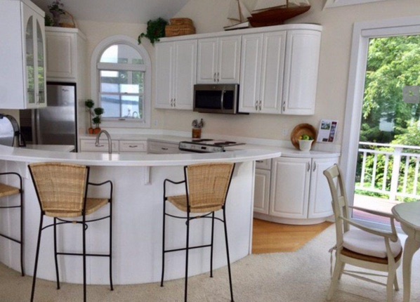 Original white lake house kitchen before renovation