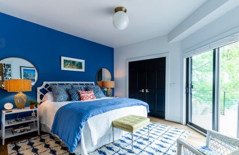 Blue lake house bedroom after renovation