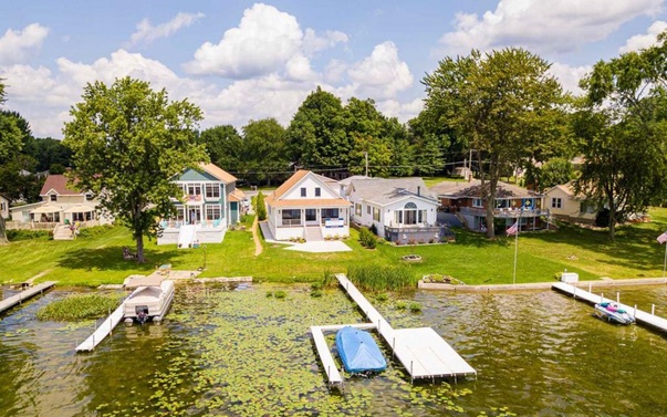 Syracuse Lake neighborhood and the completed spec house from the water