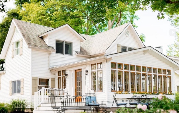Restored white lake cottage exterior