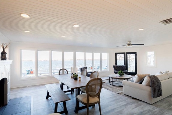 Open lake-facing living and dining room after renovation