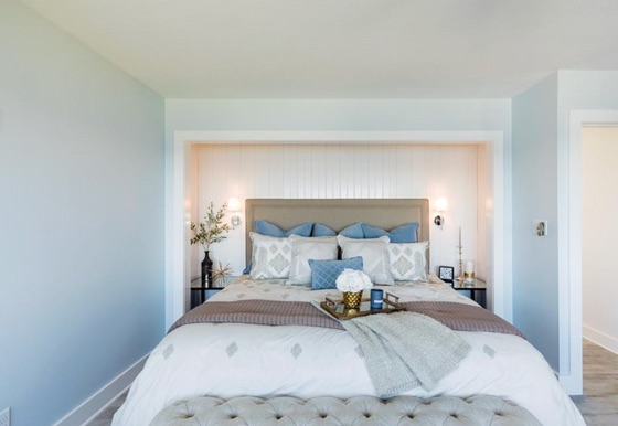 Soft blue primary bedroom after renovation